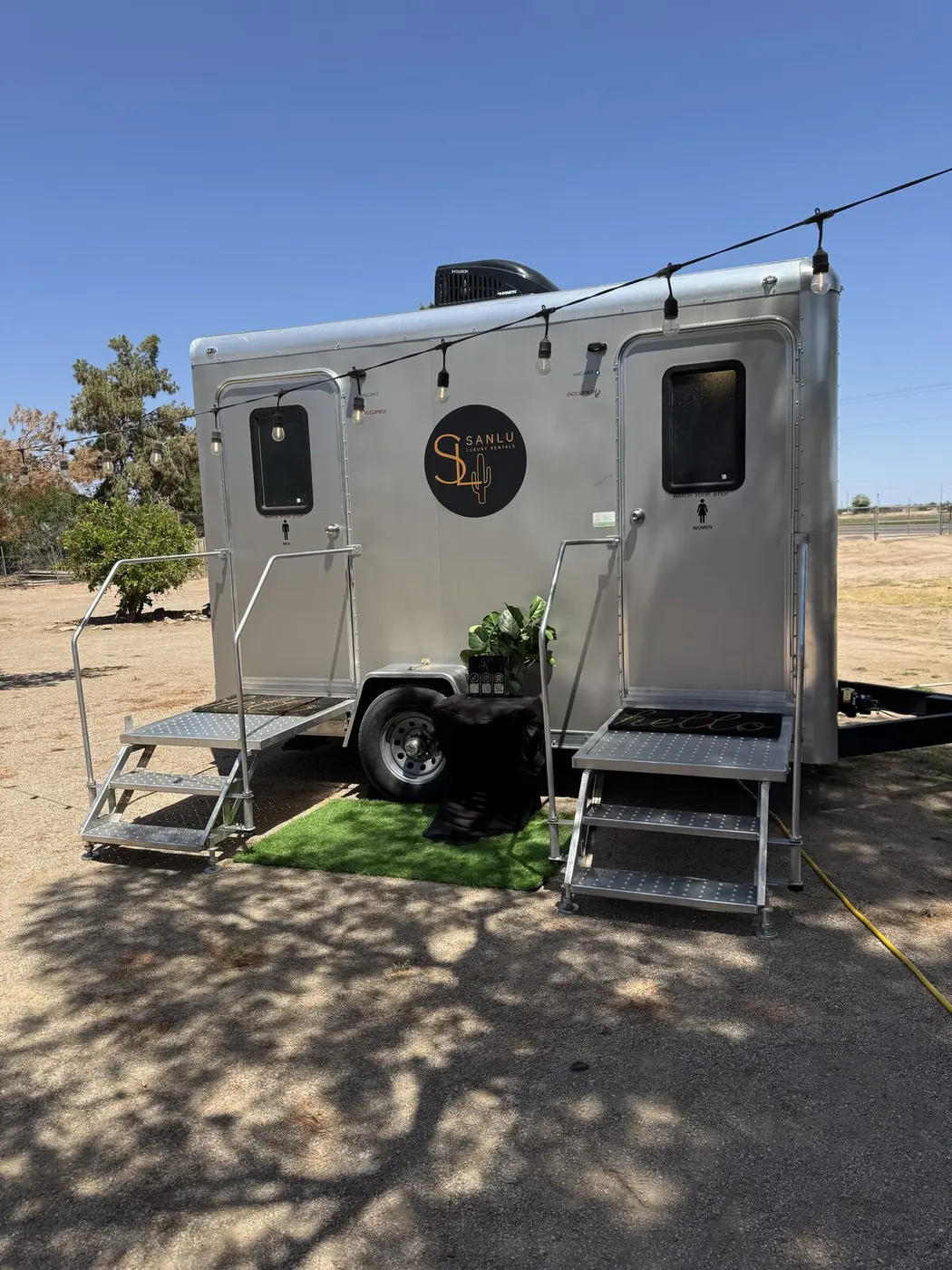 Felix double restroom trailer at golden hour